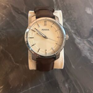 Fossil watch Silver face with brown leather band.